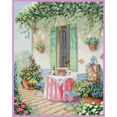 фото: картина, вышитая крестиком, столик на улице возле открытого окна, цветы